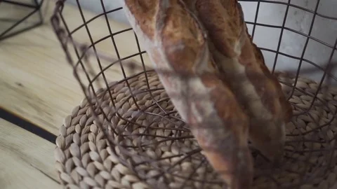 Loaf white bread on the table in basket Stock Footage 85048612