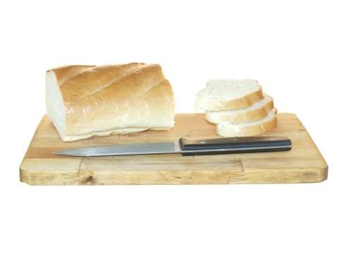 Loaf of white wheat bread sliced on a wooden cutting board and a knife isolat Foto stock