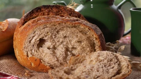 Loaf of wholemeal bread on kitchen table Stock Footage 159439312