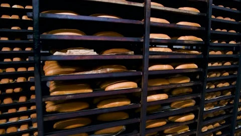 Loafs of bread in a bakery on an automated conveyor belt Stock Footage 197570249