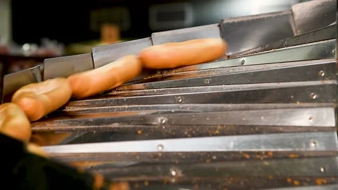 Loafs of bread in a bakery on an automated conveyor belt Stockbeeldmateriaal 237383879