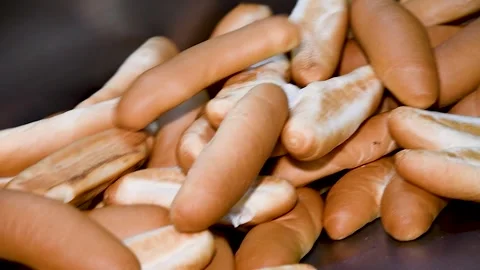 Loafs of bread in a bakery on an automated conveyor belt Stock Footage 254340099
