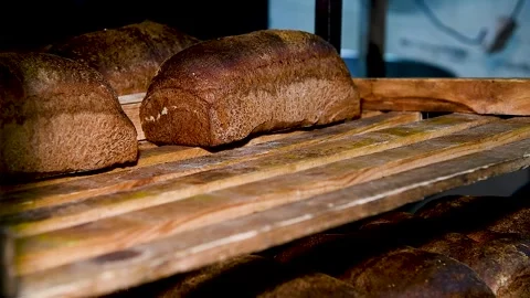 Loafs of bread in a bakery on an automated conveyor belt Stock Footage 281509333