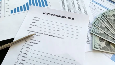 Loan application form document with graph on table Vídeo Stock 115649846