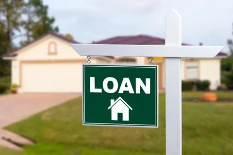 LOAN sign against a house. Close-up. Stock Photos