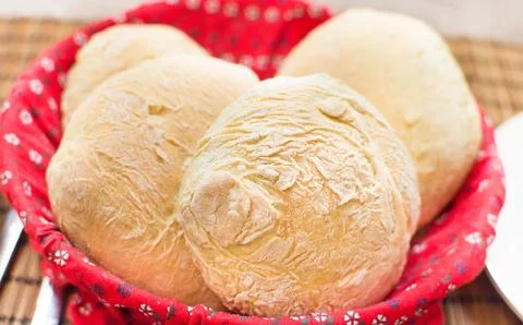 Loaves freshly baked homemade bread red basket Stock Photos