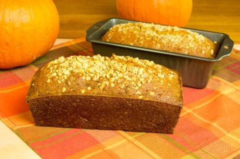 Loaves of pumpkin bread with pumpkins Stock Photos