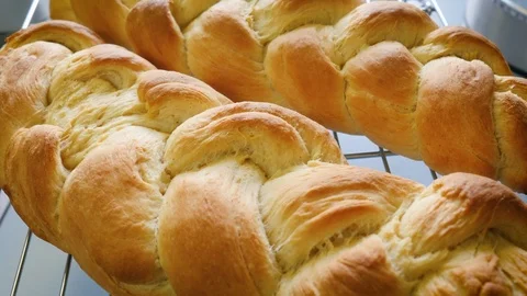 Loaves of Traditional Braided Bread Cool on a Wire Rack in a Farmhouse Kitchen Stock Footage 87843572