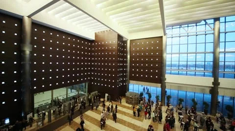Lobby with frames detectors at entrance and cafe tables with people. Stock Footage 63661510