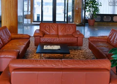 Lobby with leather sofas Stock Photos