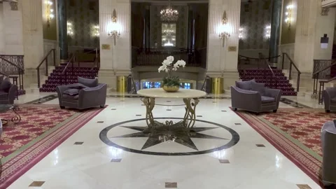 Lobby of an old hotel in vintage style with a round table in the center Stock Footage