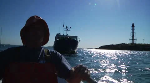 Lobsterman rows to boat Stock Footage 8912552