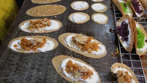 Local authentic Thai dessert named Kanom Bueng. Stock Footage 107667121