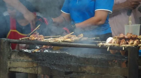 Local barbecues under cooking Stock Footage 53082684