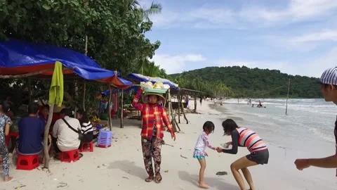 Local Beach Vendor at Sao Beach, Phu Quoc, Vietnam Stock Footage 130707940
