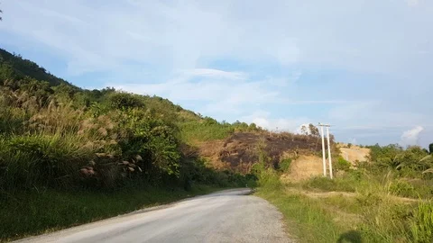 Local blue bus in motion on road in rural Laos, Houaphanh, car, hill, plants 스톡 동영상 80698894