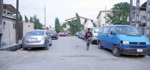 A local bread vendor on the streets of Lagos Stock Footage 105376949