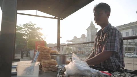 Local burmese man preparing dough for paratha cake in city center of 스톡 동영상 132967102