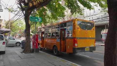 Local Bus Pulling Out of Side Road - Bangkok, Thailand Stock Footage 147617871