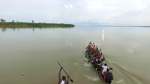 Local canoe competition. Aerial camera switches over, slow motion Stock Footage 71303175