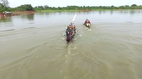 Local canoe competition of two canoes  Aerial. Stock Footage 71336835
