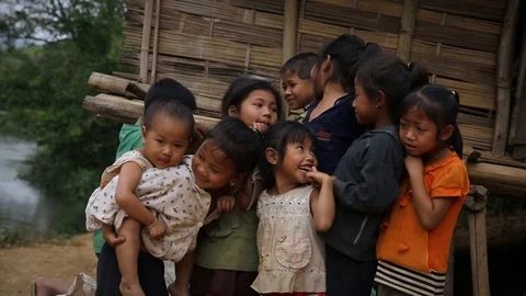 Local children posing for camera in rural Laos Stock Footage 104121269
