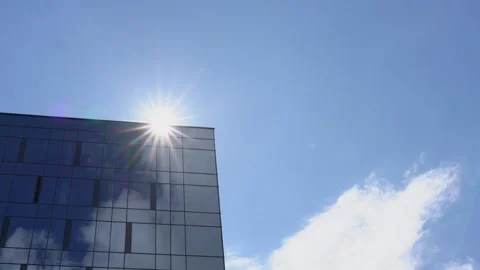 Local city building with panoramic windows reflecting sky Stock Footage 135297006