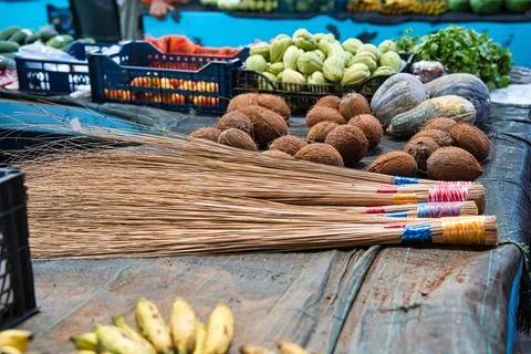 Local coconut leaves broom stick in victoria town market, Mahe Seychelles. Stock Photos