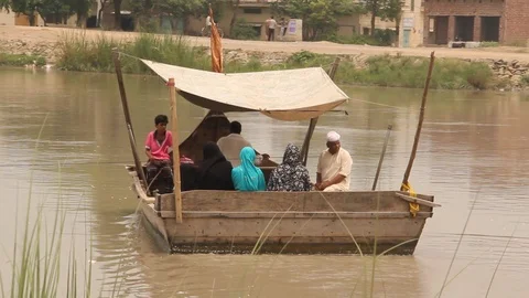 Local commuters using boat ride for crossing canal Stock Footage 86598054