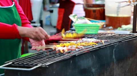 Local Cook local Thai styled Grilled squid babeque at famous Kad Kong Ta Stock Footage 65035829