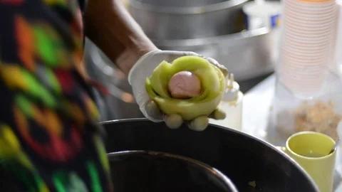 Local dish being prepared on an asian market (2) Stock Footage 123217504
