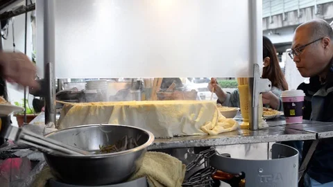 Local dish being prepared on an asian market (7) Stock Footage 123217538