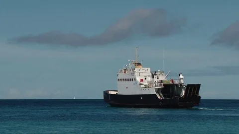 Local ferry sailing away Mayreau island, St Vincent and the Grenadines Stock Footage 85166837