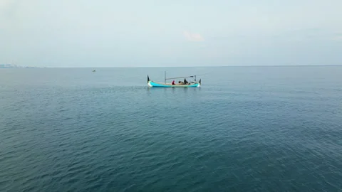 Local Fisherman In Boat North Java Coast Near Besuki Drone Track Back 4K 60FPS Vídeo Stock 342609219