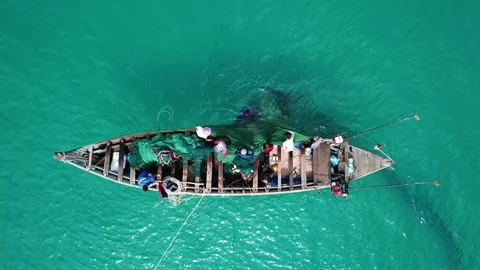 Local fishermen pull nets with special small eyes to catch small shrimp on boats Stock-Footage 164850617