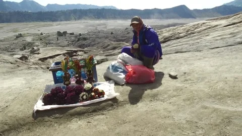 Local Flower Vendor on top of Active Volcano, Java, Indonesia Stock Footage 131152270