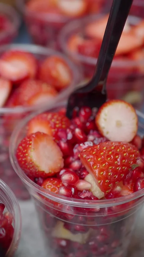 Local fruit mix with strawberries and pomegranates Stock Footage 336881360
