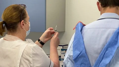 Local GP surgery begins vaccination programme Stock Footage 154690404