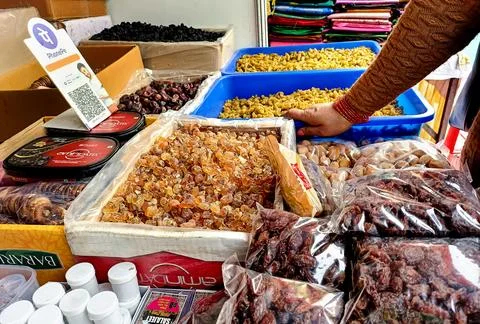 A local grocery stall displaying assorted dry fruits Stock Photos