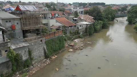 Local Indonesian Homes Back Onto The Cisadane River In Bogor West Java Stock-Footage 270209804