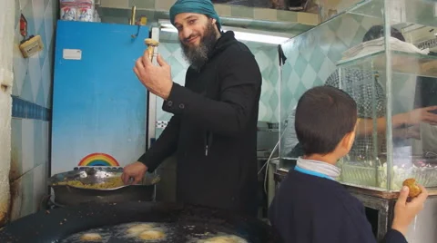 Local man making the falafel in old city of the Jerusalem in Israel Stock Footage 57424530