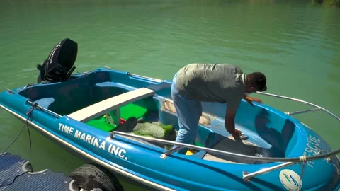 Local Man Preparing Speed Boat on Lake Maneri Shore, Bhagirathi River, Utta.. Stock Footage 292644016
