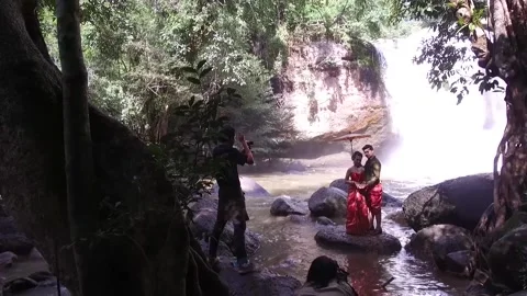 Local married couple posing in Khao Yai, Haew Suwat Waterfall, Thailand Stock Footage 130700740