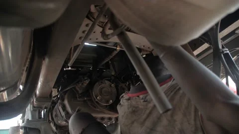 Local Mechanic Is Checking and repairing the engine of cars and truck Stock Footage 156421533