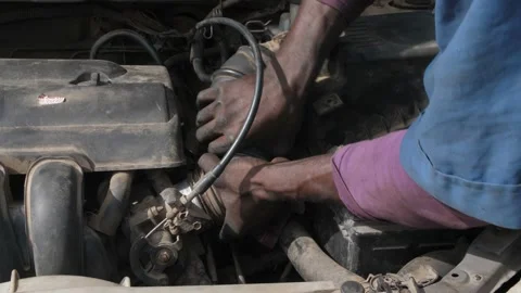 Local Mechanic Is Checking and repairing the engine of cars and truck Видео 156421734