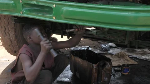 Local Mechanic Is Checking and repairing the engine of cars and truck Stock Footage 156423027