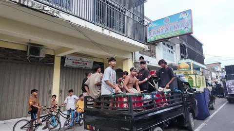 Local men preparing a parade for the Idul Fitri celebration Stock Footage 337225940