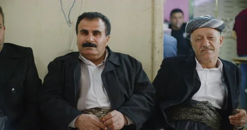Local Men As They Sit, Relax And Drink Tea Near The Citadel in Erbil, Iraq Stock Footage 150283298