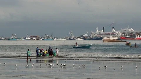 Local men trying push small boat to the sea in Manta, Ecuador Stock Footage 88814837