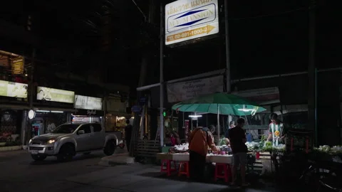 Local Night Vegetable Stall with People and Traffic in Bangkok Stock Footage 337531817